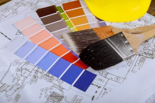Coating colour samples and building plans laid out for specifying a fireproof intumescent coating system