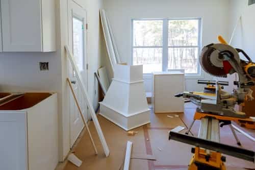 New construction interior during finish work, the stage at which insulation decisions must already be made
