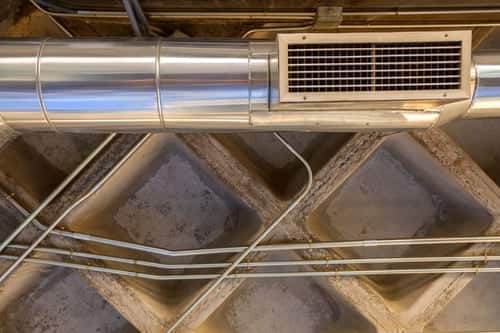 Attic ductwork and mechanical equipment above the ceiling plane where insulation performance is commonly checked